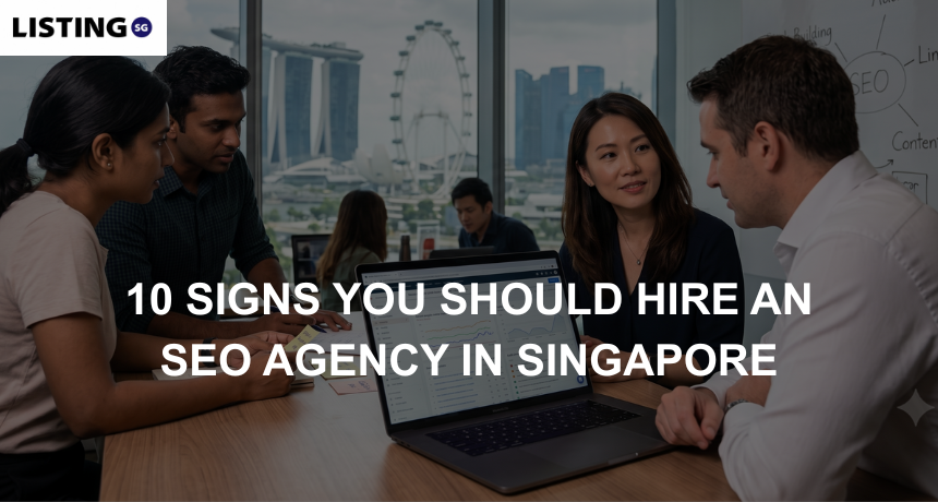 Business professionals review SEO analytics on a laptop inside a Singapore office overlooking the Marina Bay skyline.
